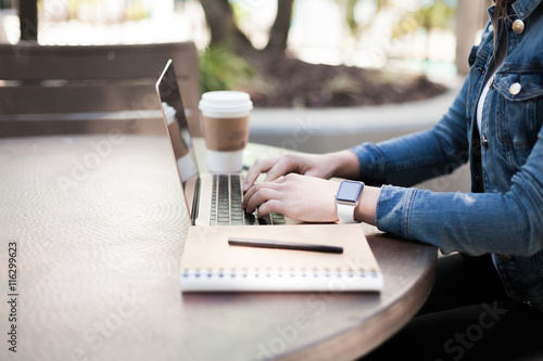 Typing on a laptop