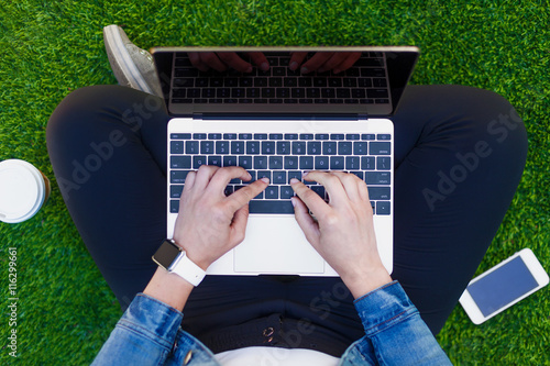 Typing on a laptop