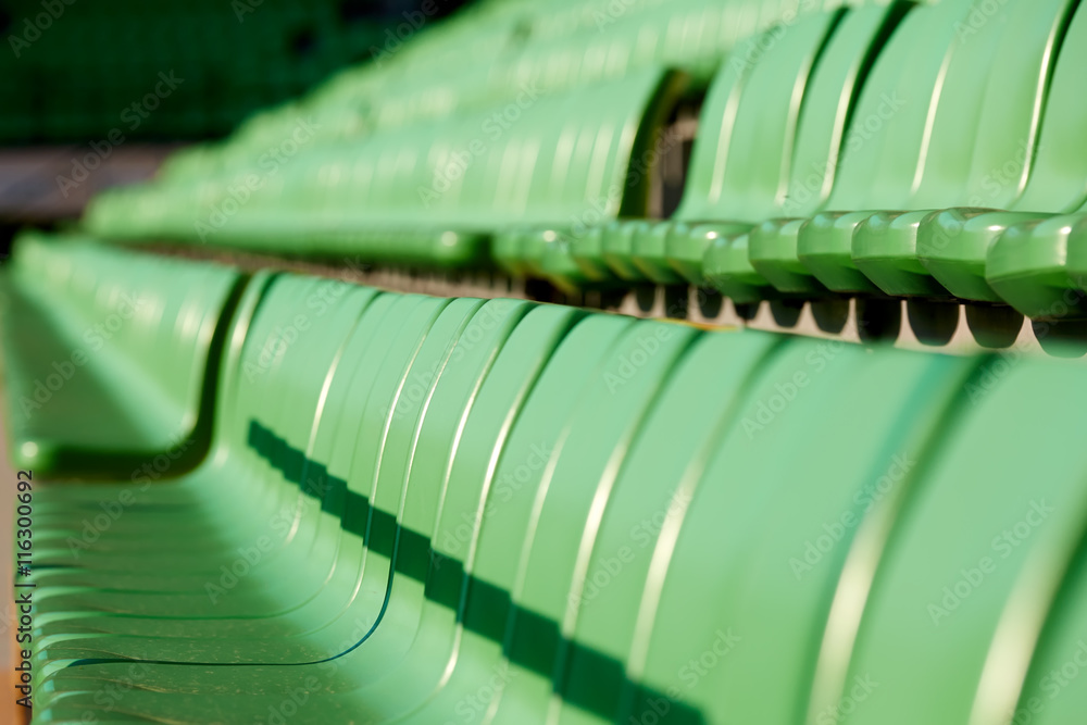 Fototapeta premium empty football stadium chairs