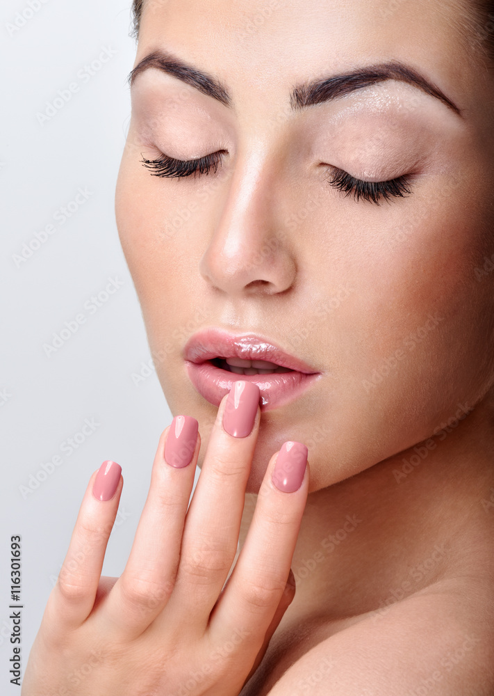 Beautiful Young Woman with Clean Fresh Skin. Close up Portrait.