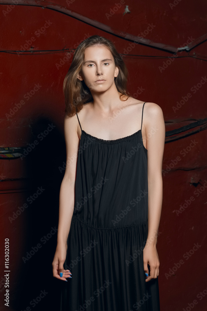 fashion model in long designers black dress in night show fashion model in long designers black dress in night show