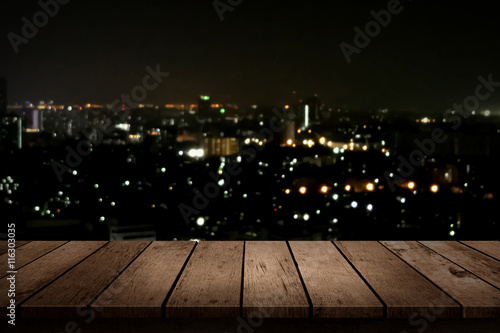 wood table top on night city background
