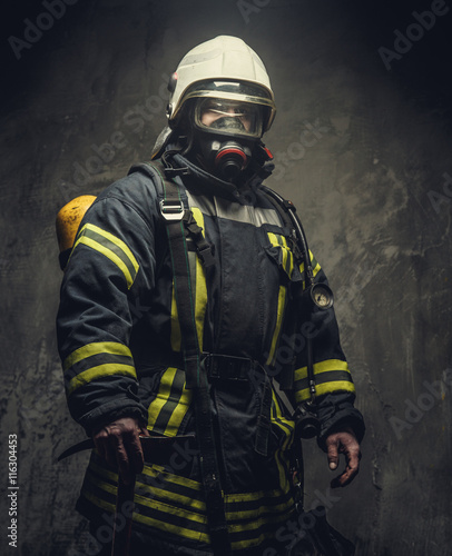 Fototapeta Naklejka Na Ścianę i Meble -  Portrait of firefighter in oxygen mask.