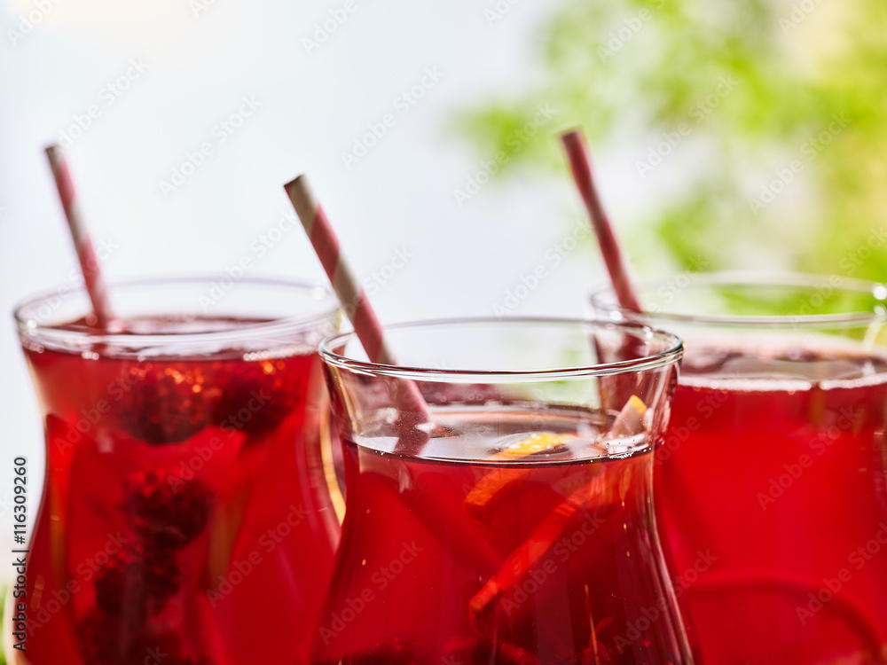 On wooden boardspart of ice cold beverage glass with red raspberry lemon cocktail . Part of alcohol country cocktail beverage number two hundred and nine with mint. Group cocktails on outdoor. On wooden boardspart of ice cold beverage glass with red raspberry lemon cocktail . Part of alcohol country cocktail beverage number two hundred and nine with mint. Group cocktails on outdoor.