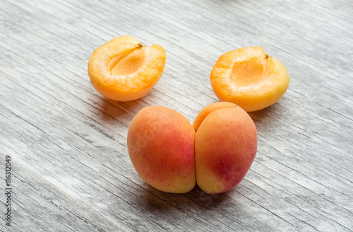 Fresh apricots on wooden table