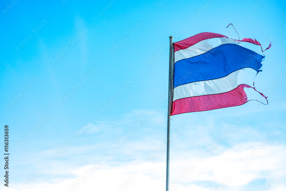 thailand flag is torn like the democracy of thailand now