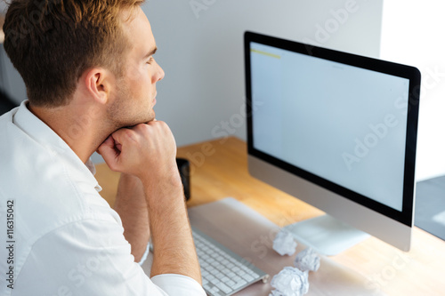 Businessman working with blank screen computer in office