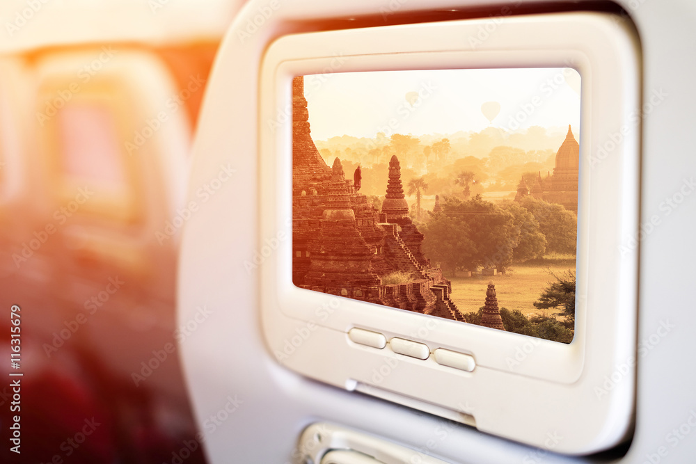 Aircraft monitor in front of passenger seat showing Bagan temple