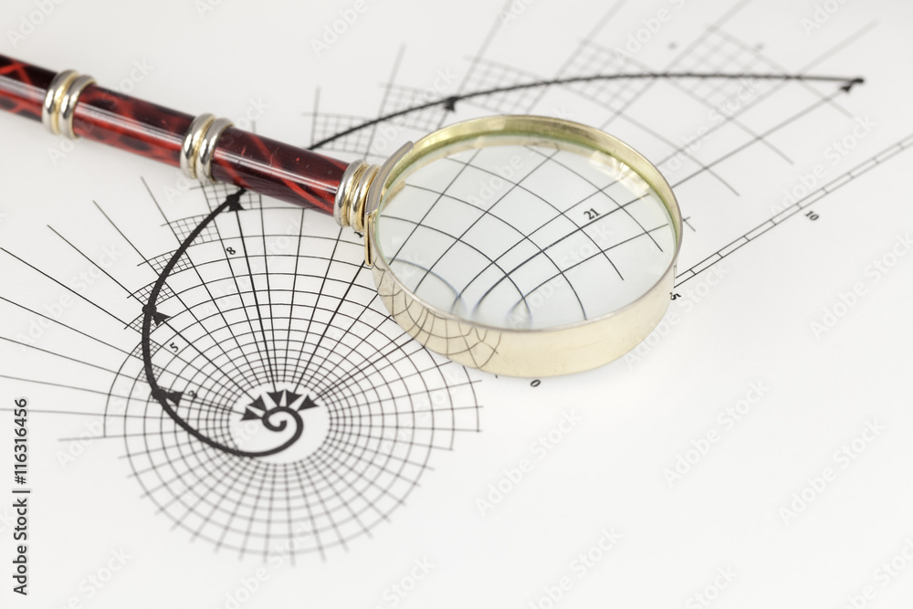 magnifying glass & drawing of the golden section magnifying glass & drawing of the golden section