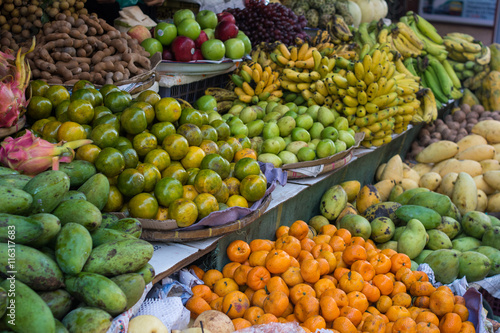 Display of Various fruits on a shelf in Asian food market