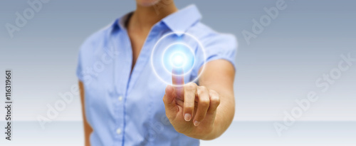 Φωτογραφία Businesswoman touching modern tactile screen button