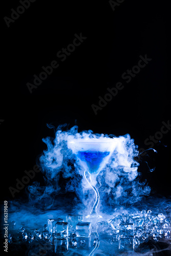 blue cocktail with splash and ice vapor