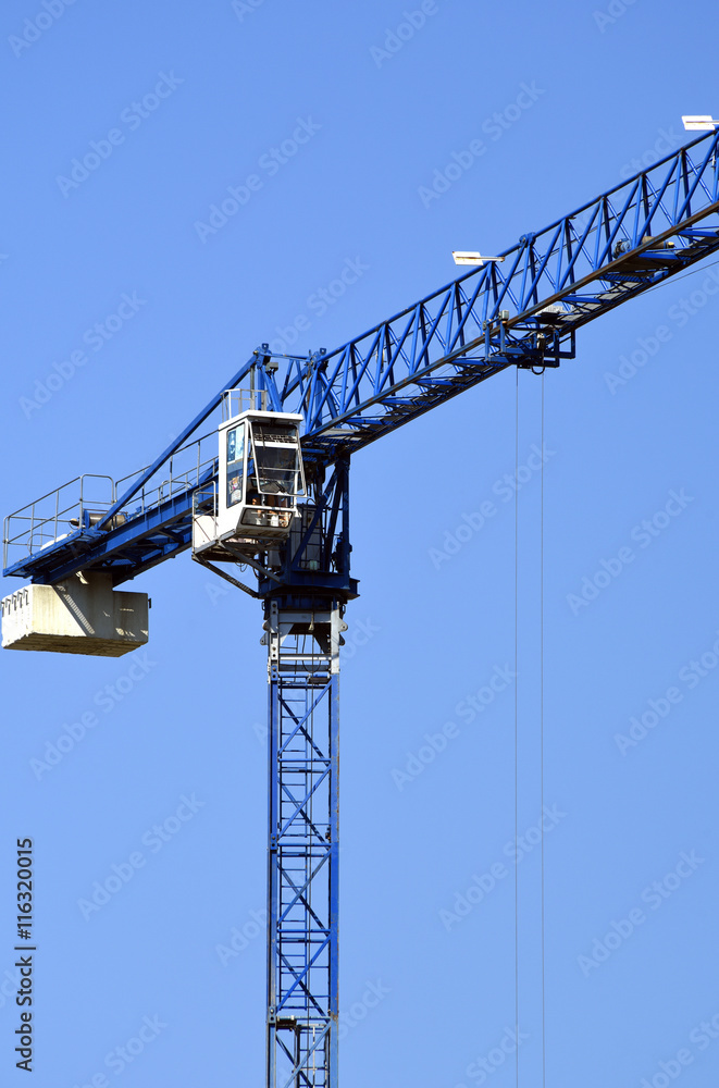 Construction crane on a blue sky