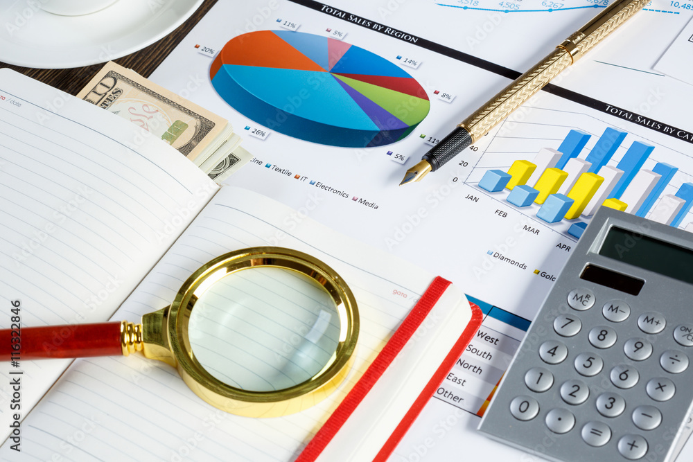 Financial charts and graphs on the table Financial charts and graphs on the table