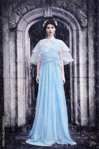 Woman in the cemetery - romantic gothic winter scenery
