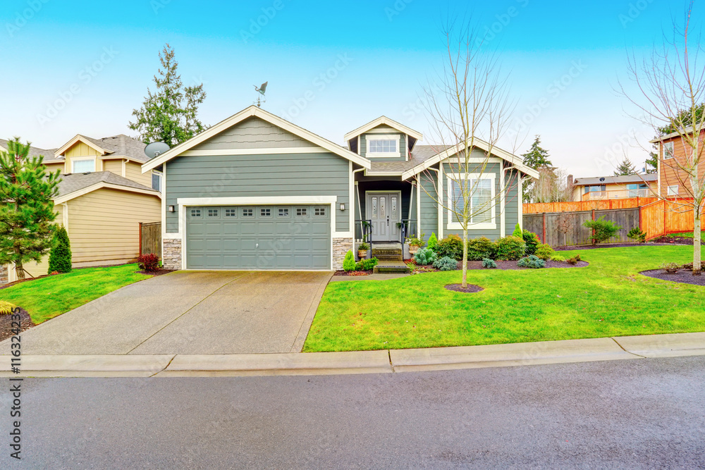 Fototapeta premium Curb appeal. House exterior with garage and driveway