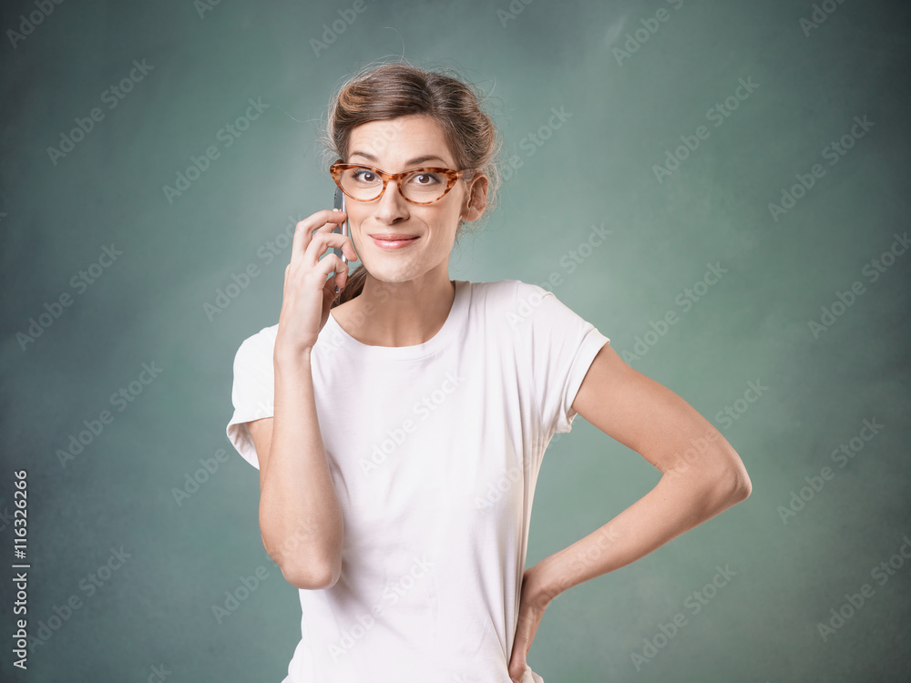 Smiling girl makes phone call