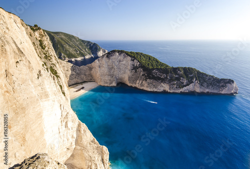 Navagio beach with shipwreck and motor boat on Zakynthos island in Greece, background