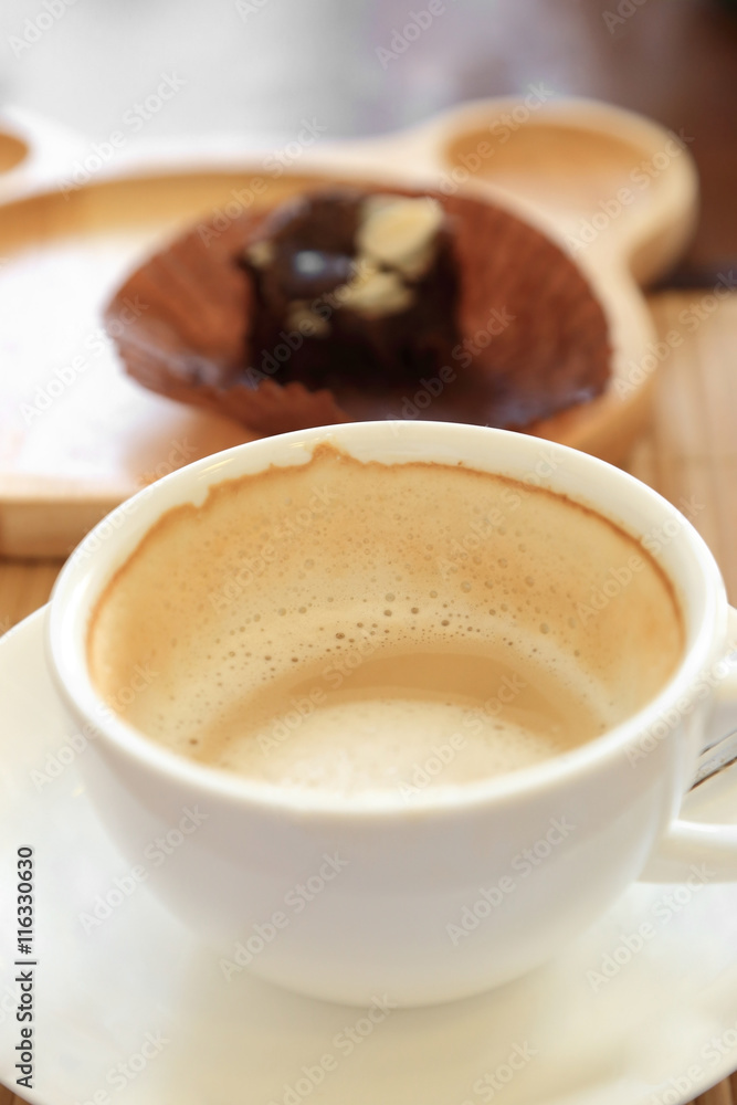 Cup of coffee on wooden table with confectioners atmosphere. Cup of coffee on wooden table with confectioners atmosphere.