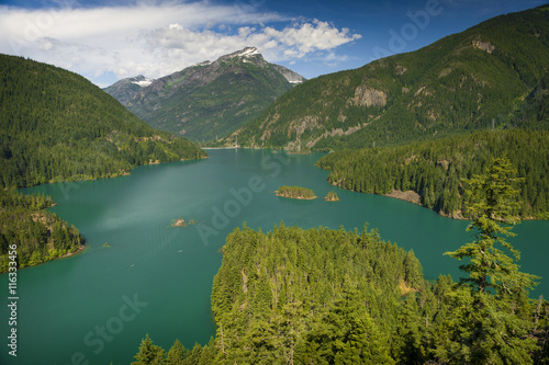 Diablo Lake. Created by Diablo Dam  the lake is located between Ross Lake and Gorge Lake on the Skagit River. The unique  intense turquoise hue is from glacial rock ground to a fine powder.