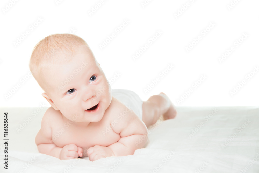 Little boy lying on stomach and smiling Little boy lying on stomach and smiling