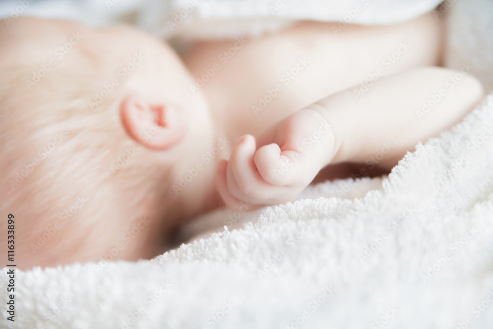 Sleeping newborn baby covered with white blanket. Sleeping newborn baby covered with white blanket.