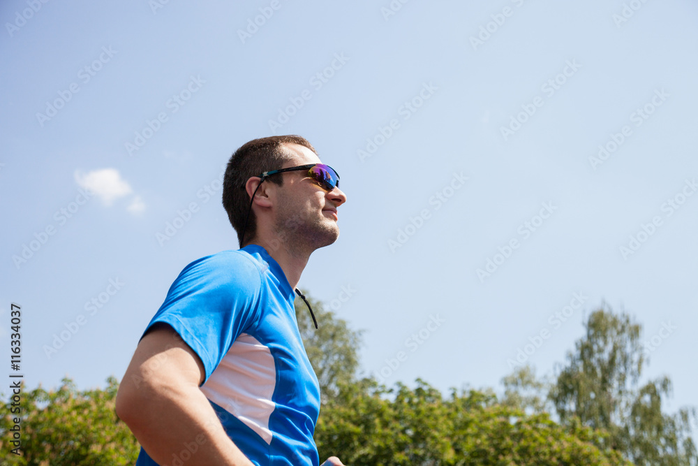 Young man running in the park Young man running in the park