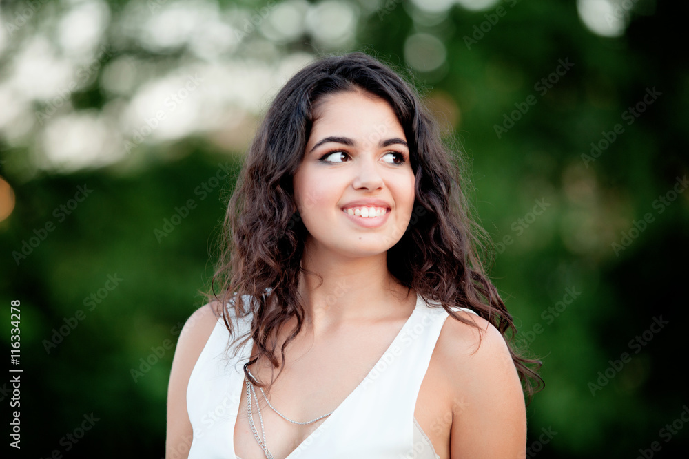 Beautiful brunette girl relaxing in the park Beautiful brunette girl relaxing in the park