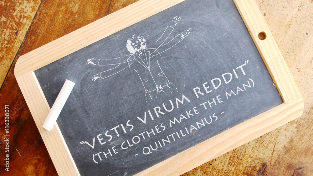 Vestis virum reddit. A Latin phrase meaning “The clothes make the man”.  Stock Photo | Adobe Stock