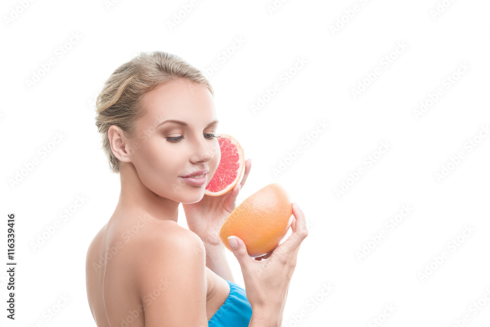 Young blonde woman with grapefruit Young blonde woman with grapefruit