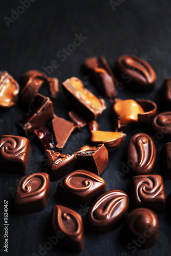 Chocolate over black background. Chocolate Candy, Cocoa. Assortm photo