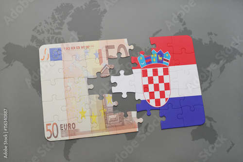 Fototapeta Naklejka Na Ścianę i Meble -  puzzle with the national flag of croatia and euro banknote on a world map background.