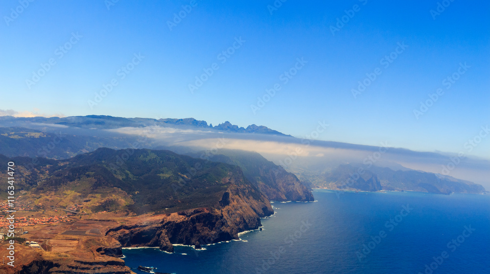 Beautiful aerial view from the plane before landing over Funchal city on Madeira island, Portugal