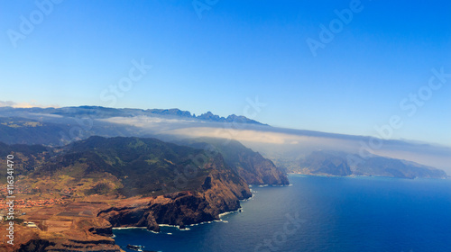 Beautiful aerial view from the plane before landing over Funchal city on Madeira island, Portugal