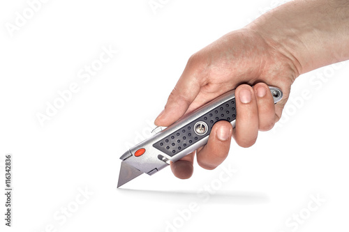 man's hand holding a knife stationery photo