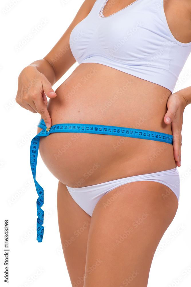Measuring girth tummy with meter tape. Pregnancy. Pregnant belly