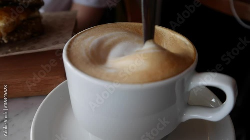 Person Stirs the Coffee