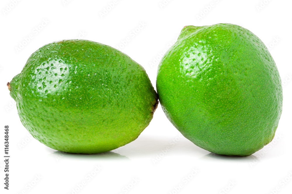 two lime isolated on white background close up