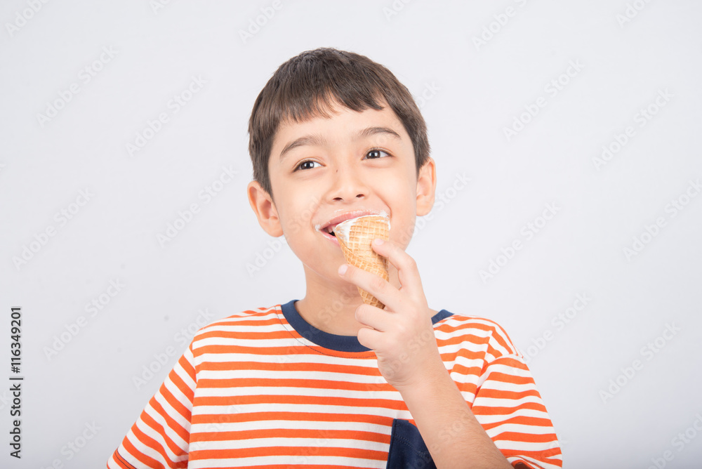 Little boy eating chocolate icecream with happy face summer time Little boy eating chocolate icecream with happy face summer time