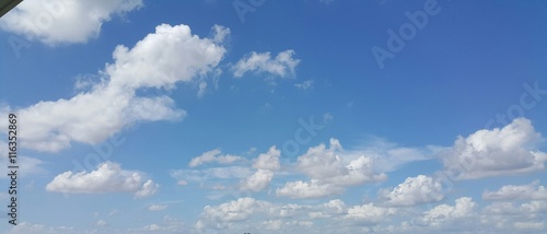 Low angle white clouds with clear blue sky 