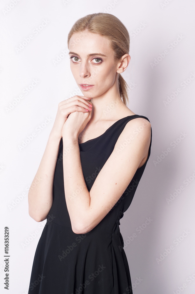 Portrait of a sophisticated girl in the black dress Portrait of a sophisticated girl in the black dress