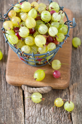 gooseberries on wooden surface