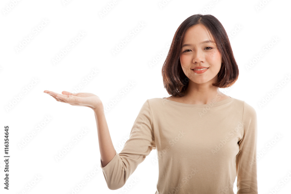 Beautiful young Asian woman show palm hand isolated on white background Beautiful young Asian woman show palm hand isolated on white background