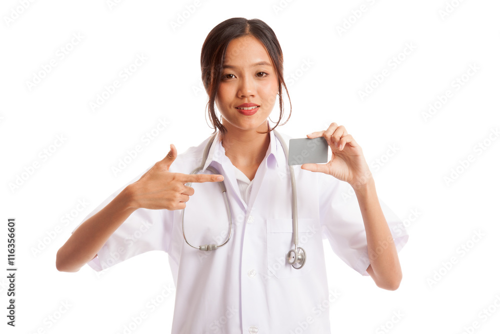Asian young female doctor point to blank card isolated on white background Asian young female doctor point to blank card isolated on white background