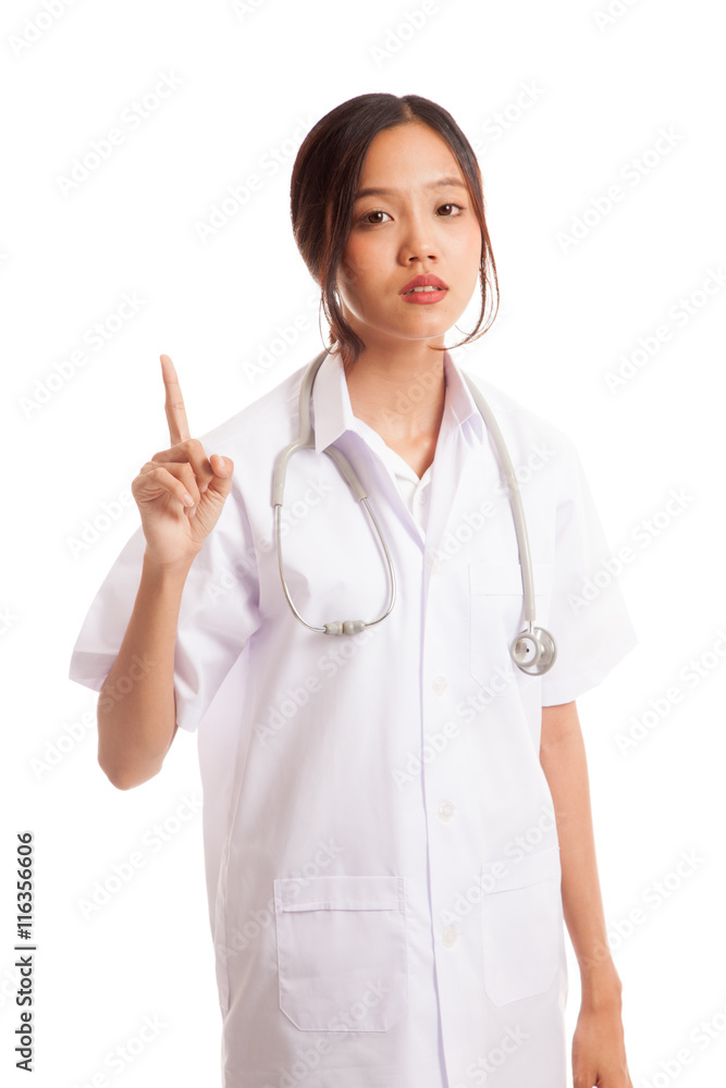 Asian young female doctor point up isolated on white background Asian young female doctor point up isolated on white background