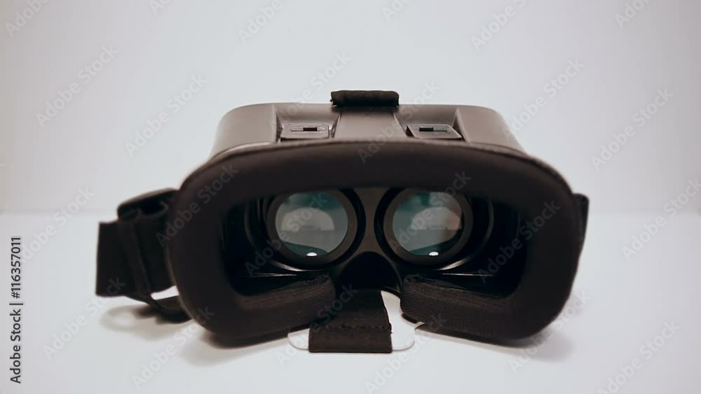 Virtual reality glasses for the smartphone on the white background, smartphone is working, Virtual reality glasses for the smartphone on the white background, smartphone is working,