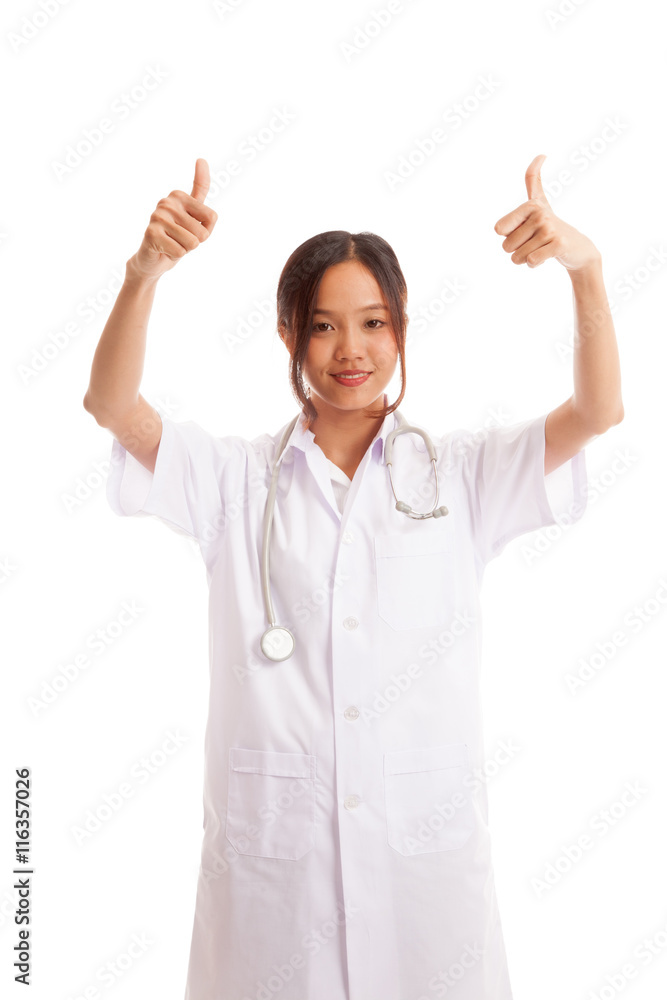Young Asian female doctor show two thumbs up isolated on white background Young Asian female doctor show two thumbs up isolated on white background