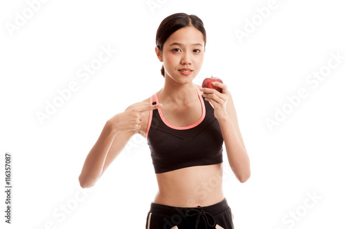 Beautiful Asian healthy girl point to red apple  isolated on white background © halfbottle