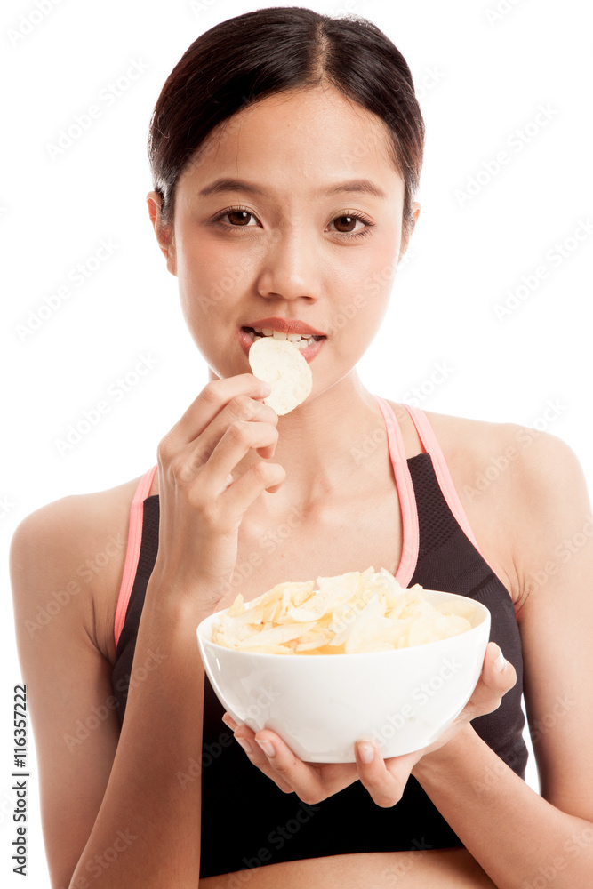 Beautiful Asian healthy girl eat potato chips isolated on white background Beautiful Asian healthy girl eat potato chips isolated on white background