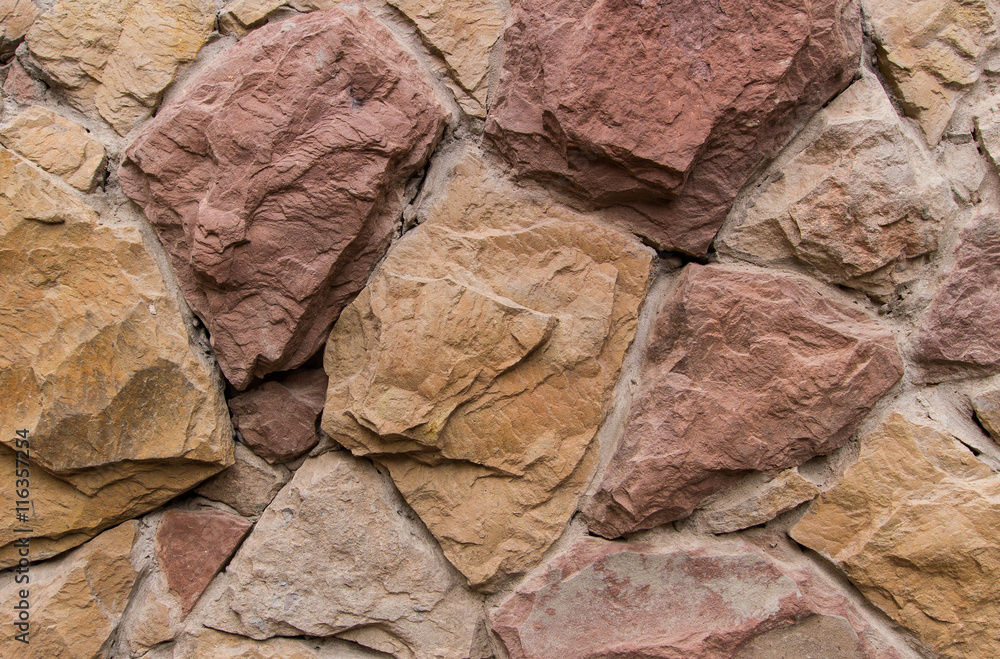Fototapeta premium Old stone wall. / Wall of the old large stones, beige and brown shades
